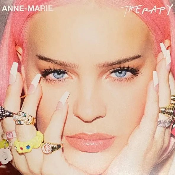 Anne-Marie – Therapy LP on orange vinyl with album artwork featuring futuristic visuals and stylized typography.