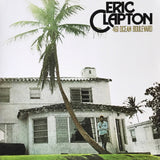 Classic Eric Clapton album sleeve showing relaxed portrait outside Miami home.