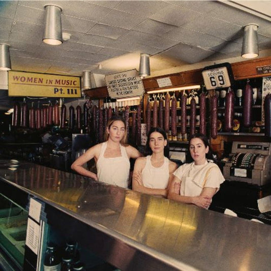 HAIM Women in Music Pt. III album cover with bold yellow design