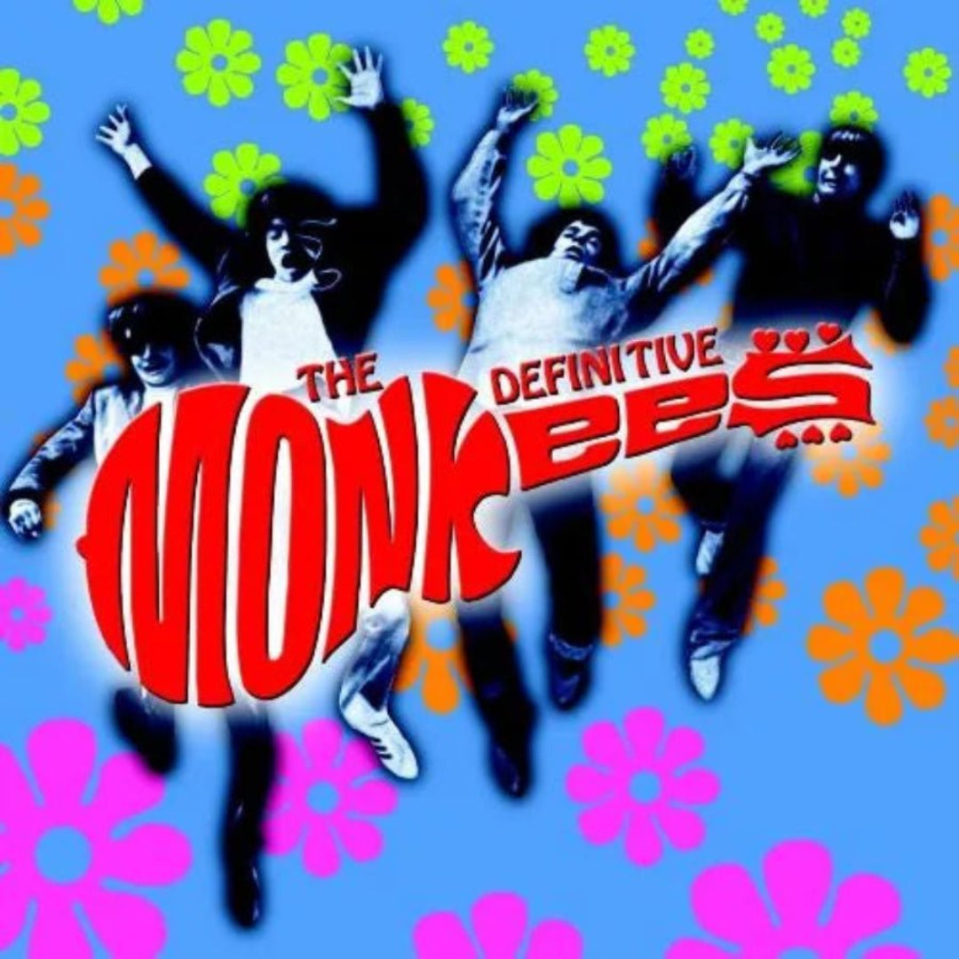 Album cover for 'The Monkees' with colorful flowers and text on a blue background