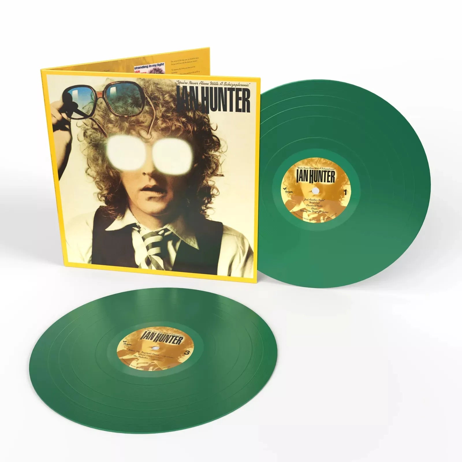 Close-up of 2 LP green vinyl set showing discs, labels, and cover artwork details.