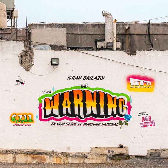 Graffiti on a wall with colorful text and logos, featuring 'The Warning' and 'Fermin Vargas'.