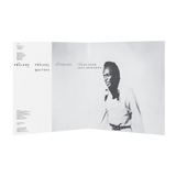 Detail of Miles Davis – Agharta 50th Anniversary Edition showing spine, gatefold artwork, and textured laminate finish.