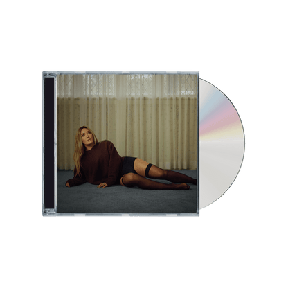 Hilary Duff’s sixth studio album artwork featuring confident minimal pop styling.