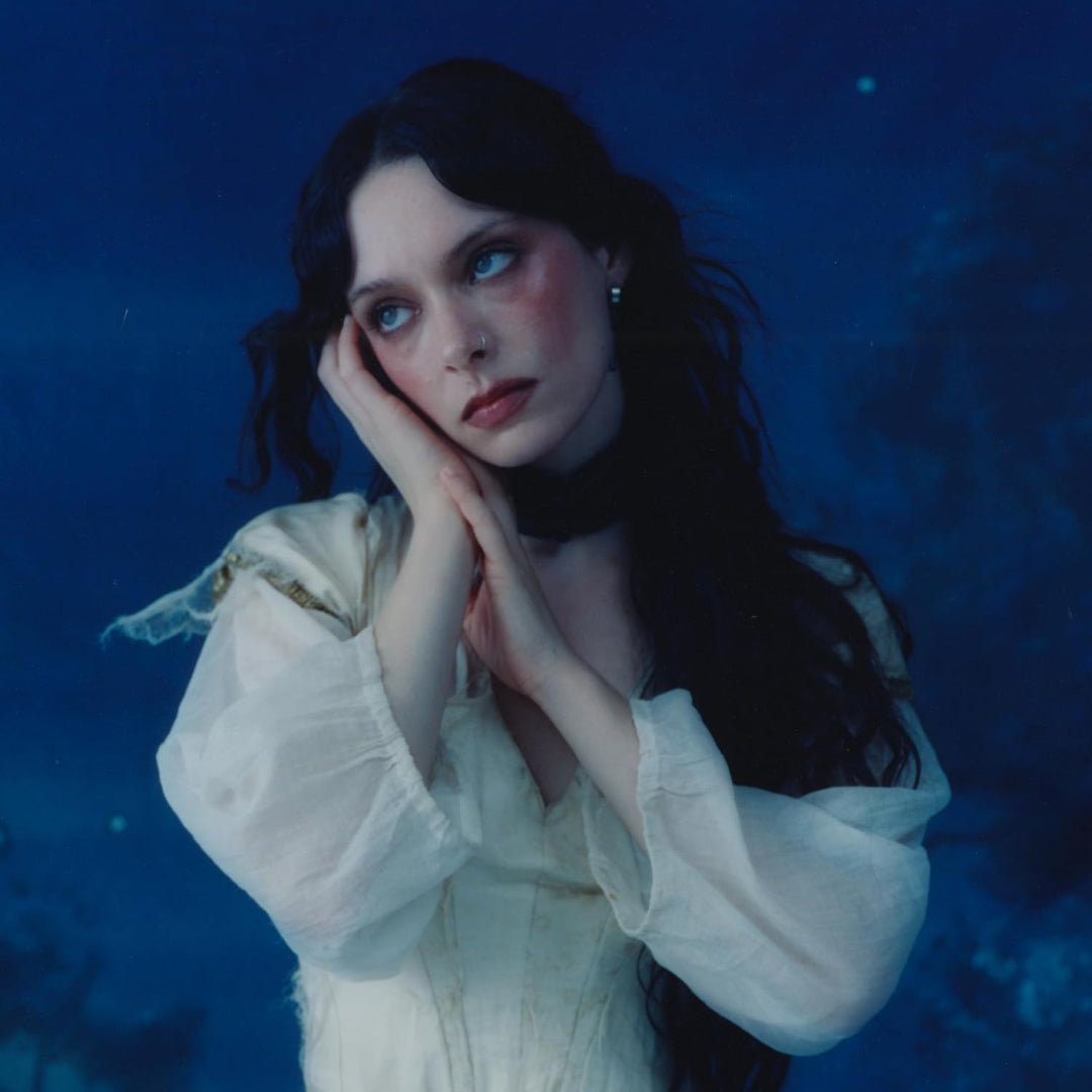 Cruel World by Holly Humberstone album sleeve showing moody imagery and title text.
