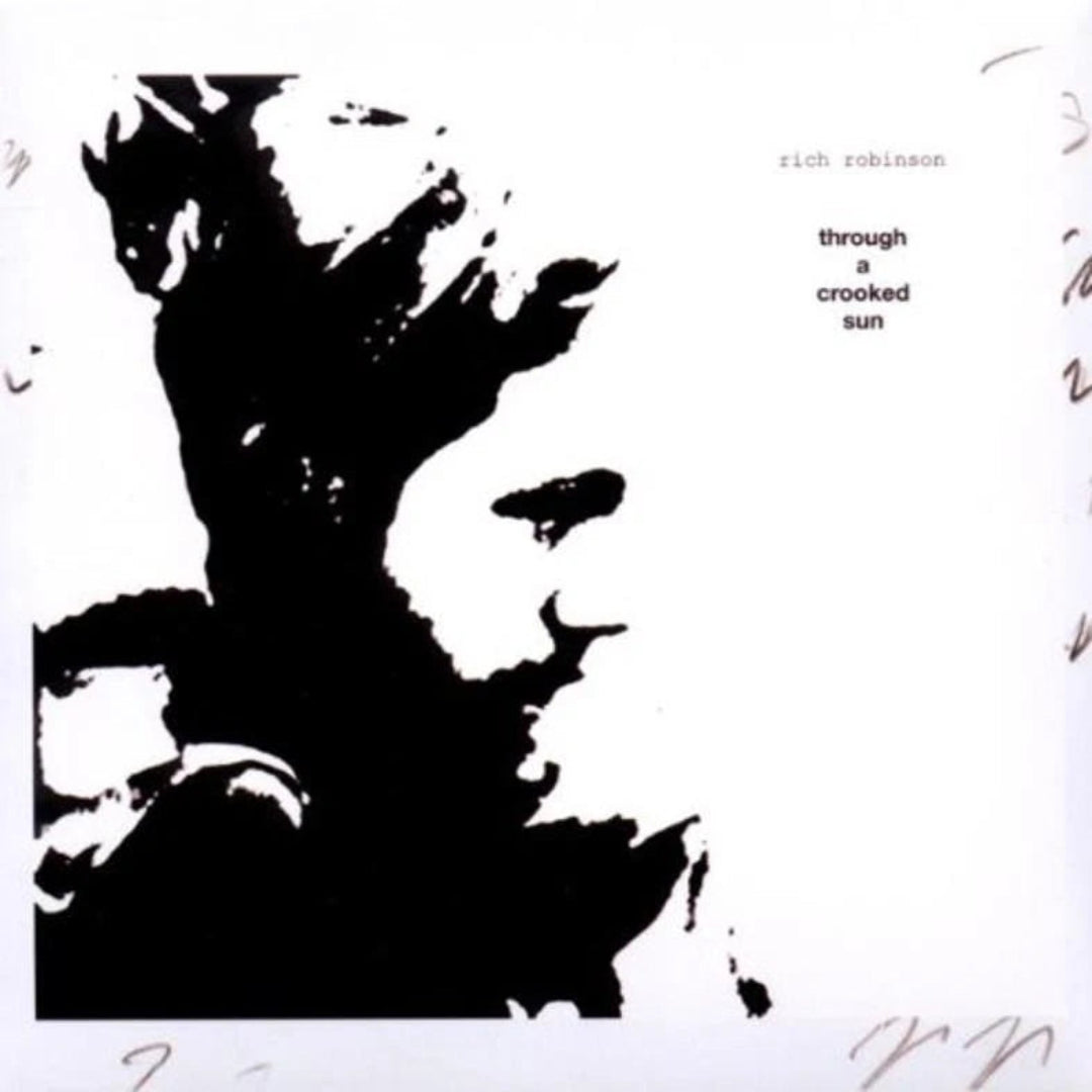 Rich Robinson Through A Crooked Sun CD featuring the official album cover artwork.