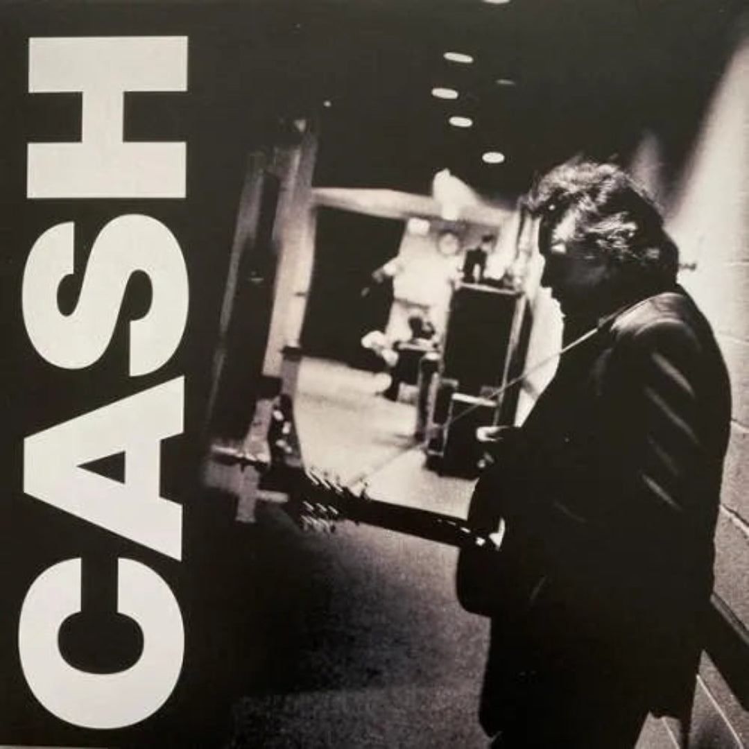American III: Solitary Man by Johnny Cash, a classic country album on vinyl.