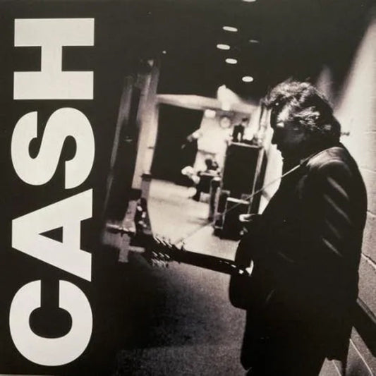 American III: Solitary Man by Johnny Cash, a classic country album on vinyl.