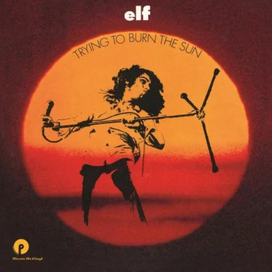 Cover of Elf's Trying to Burn the Sun featuring fantasy-style artwork and band logo.

