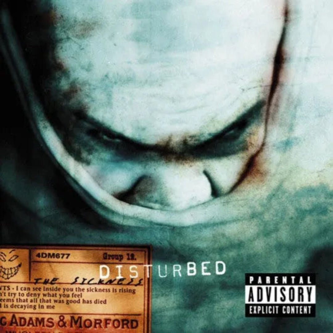 Disturbed The Sickness CD album cover artwork featuring the iconic grinning face