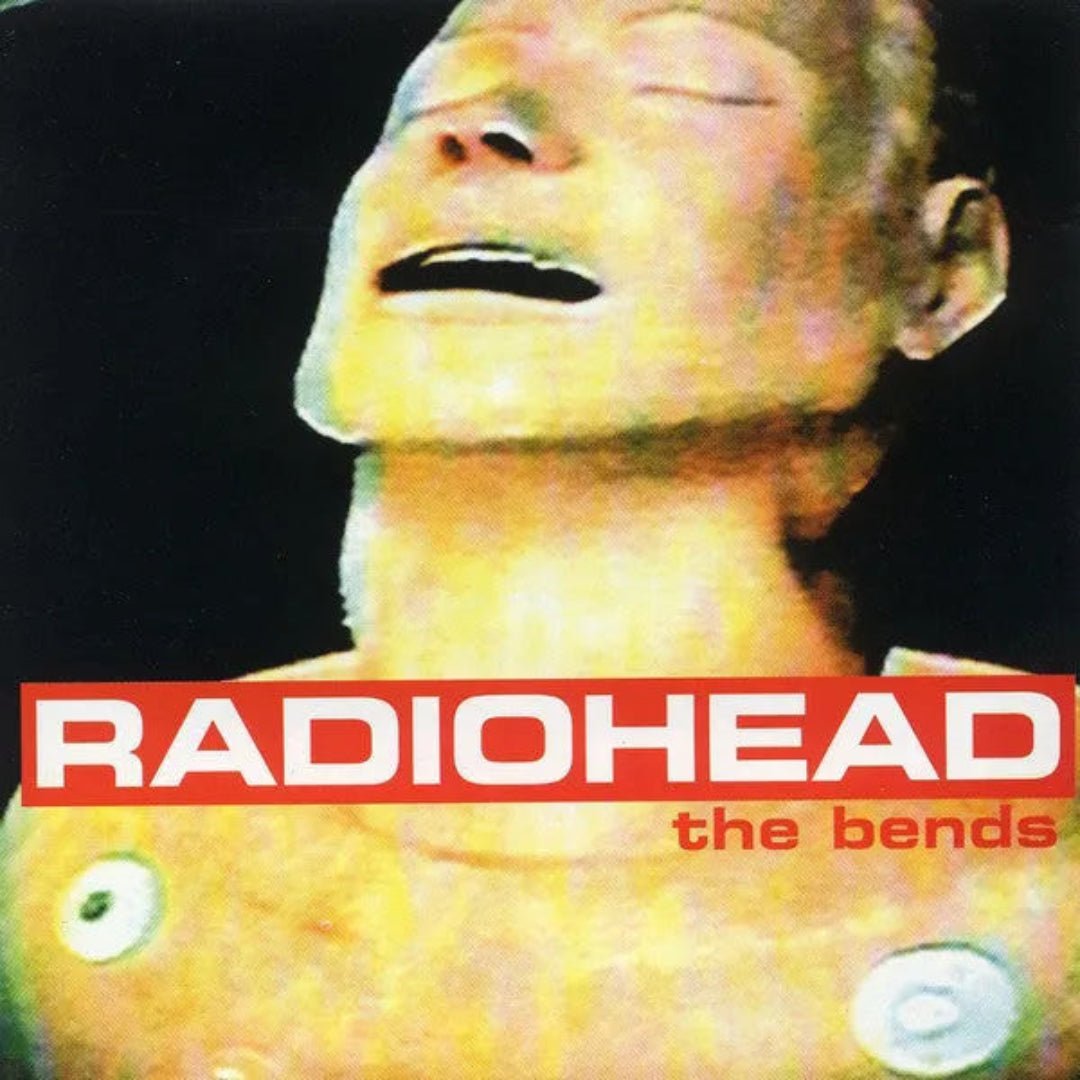 Radiohead – The Bends vinyl album with artwork featuring head statue and sky