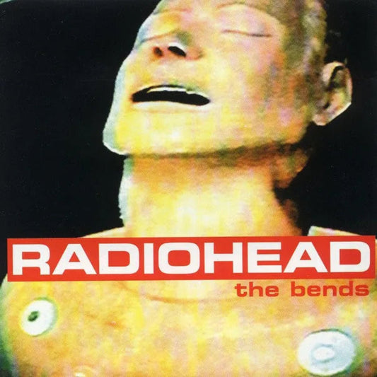 Radiohead – The Bends vinyl album with artwork featuring head statue and sky