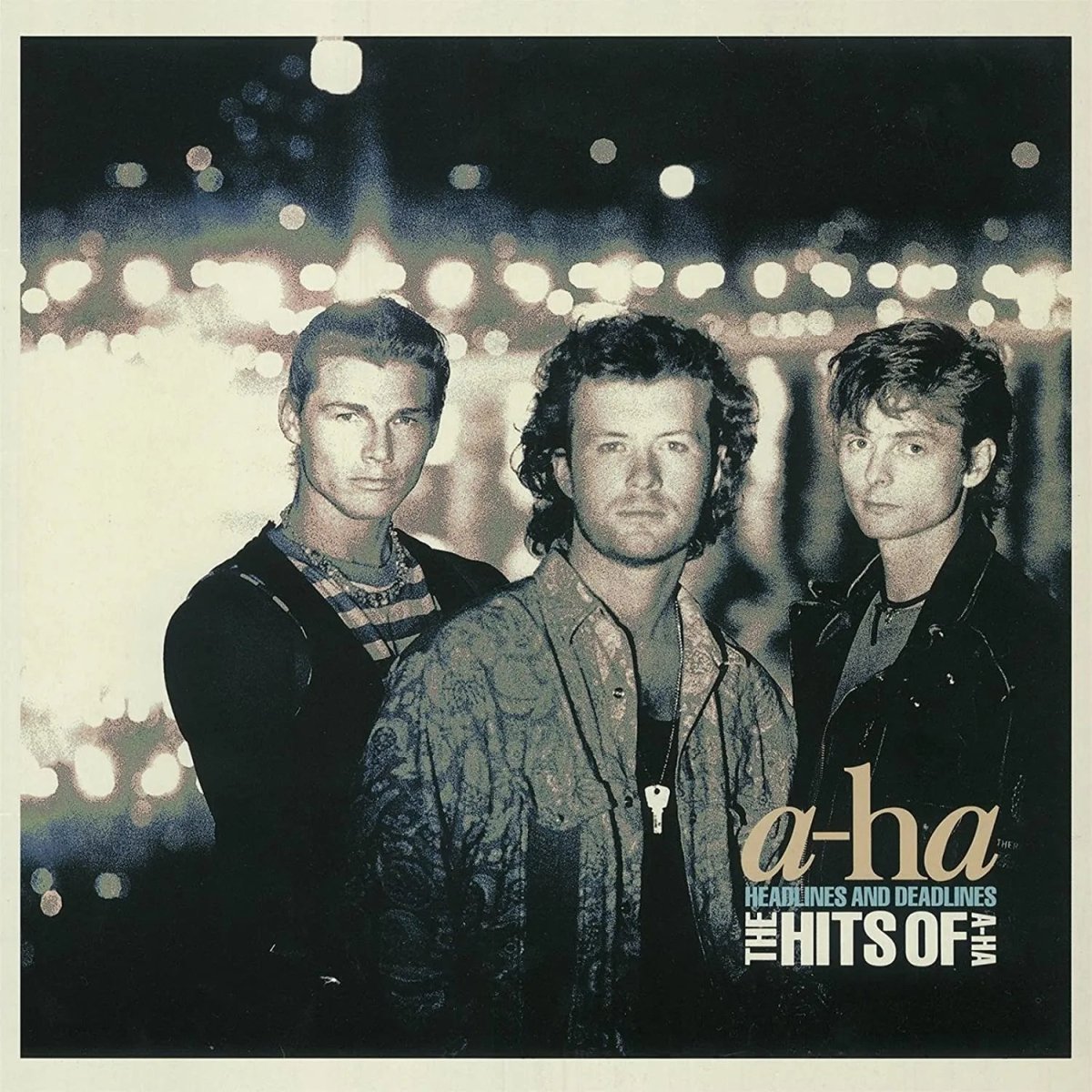 A-Ha band portrait on Headlines And Deadlines album cover with 80s styling